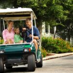 A family driving a street legal golf cart