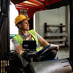 Golf cart driver in an industrial facility